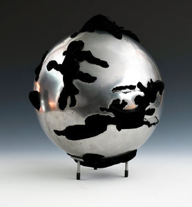 Steel Sphere with Velvet Fabric  Diameter: 12" (30 cm) - Thickness: 1/8" (3 mm)  Fabric: Velvet - black  Steel is layered 1 depth below the surface in a few areas  Style: Enclosed  Weight 16 lbs (7 kg)